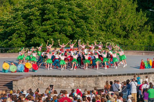 KIEV, UKRAINE - July 22 , 2016: Ukraina School of Dance Ensemble girls and boys dressed in traditional red Ukrainian embroidered costume clothes dancing