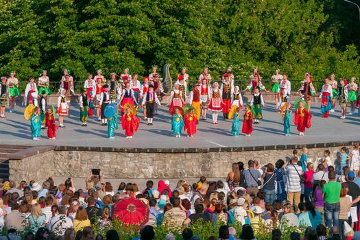 KIEV, UKRAINE - July 22 , 2016: Ukraina School of Dance Ensemble girls and boys dressed in traditional red Ukrainian embroidered costume clothes dancing