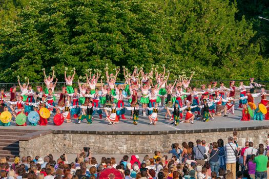 KIEV, UKRAINE - July 22 , 2016: Ukraina School of Dance Ensemble girls and boys dressed in traditional red Ukrainian embroidered costume clothes dancing