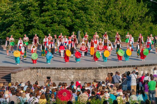 KIEV, UKRAINE - July 22 , 2016: Ukraina School of Dance Ensemble girls and boys dressed in traditional red Ukrainian embroidered costume clothes dancing