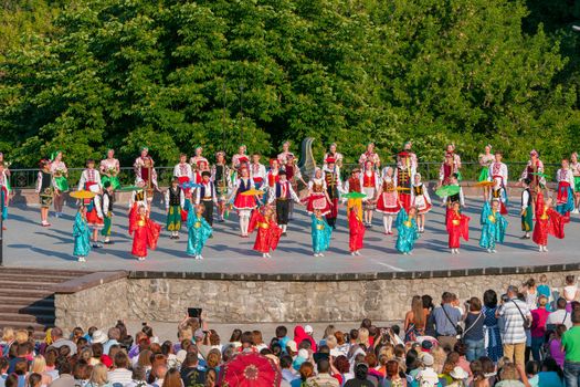 KIEV, UKRAINE - July 22 , 2016: Ukraina School of Dance Ensemble girls and boys dressed in traditional red Ukrainian embroidered costume clothes dancing