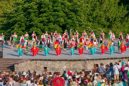 KIEV, UKRAINE - July 22 , 2016: Ukraina School of Dance Ensemble girls and boys dressed in traditional red Ukrainian embroidered costume clothes dancing