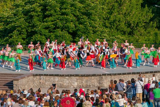 KIEV, UKRAINE - July 22 , 2016: Ukraina School of Dance Ensemble girls and boys dressed in traditional red Ukrainian embroidered costume clothes dancing