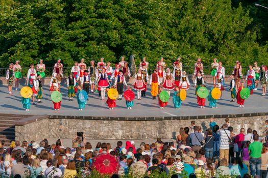 KIEV, UKRAINE - July 22 , 2016: Ukraina School of Dance Ensemble girls and boys dressed in traditional red Ukrainian embroidered costume clothes dancing