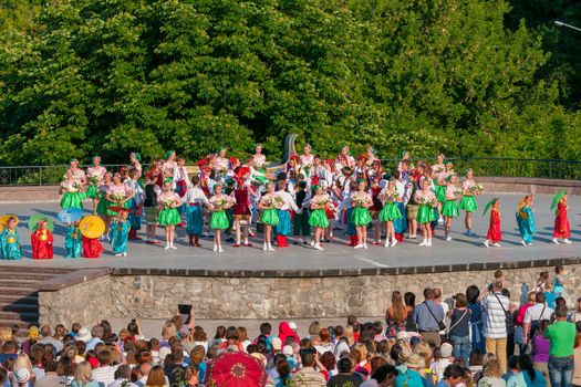 KIEV, UKRAINE - July 22 , 2016: Ukraina School of Dance Ensemble girls and boys dressed in traditional red Ukrainian embroidered costume clothes dancing