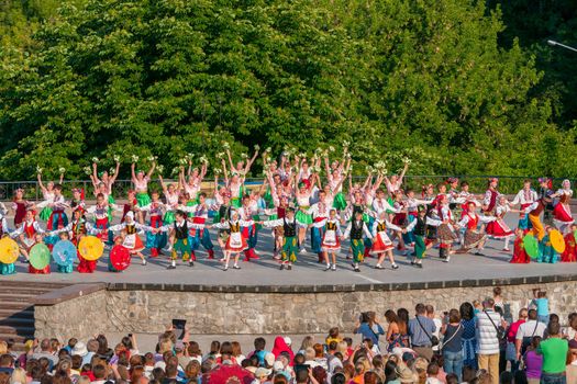 KIEV, UKRAINE - July 22 , 2016: Ukraina School of Dance Ensemble girls and boys dressed in traditional red Ukrainian embroidered costume clothes dancing