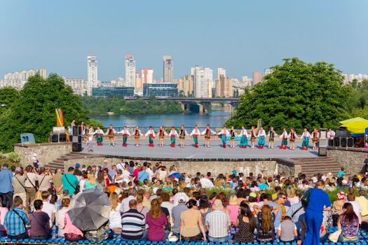 KIEV, UKRAINE - July 22 , 2016: Ukraina School of Dance Ensemble girls and boys dressed in traditional red Ukrainian embroidered costume clothes dancing