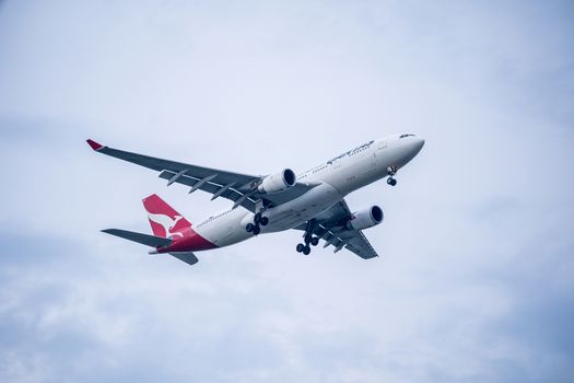 Bangkok, Thailand - May 4, 2018: Qantas airbus approaches runway for a landing at Suvarnabhumi International Airport, Bangkok, Thailand.