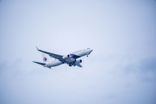 Bangkok, Thailand - May 4, 2018: Malaysia airbus approaches runway for a landing at Suvarnabhumi International Airport, Bangkok, Thailand.