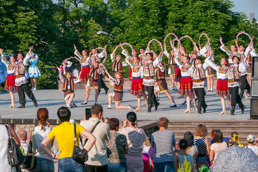 KIEV, UKRAINE - July 22 , 2016: Ukraina School of Dance Ensemble girls and boys dressed in traditional red Ukrainian embroidered costume clothes dancing