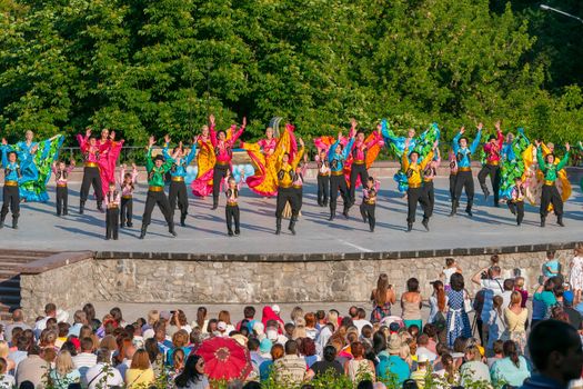 KIEV, UKRAINE - July 22 , 2016: Ukraina School of Dance Ensemble girls and boys dressed in traditional red Ukrainian embroidered costume clothes dancing