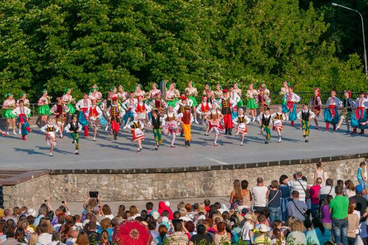 KIEV, UKRAINE - July 22 , 2016: Ukraina School of Dance Ensemble girls and boys dressed in traditional red Ukrainian embroidered costume clothes dancing