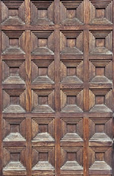 Close up of an old wooden gate of a medieval house