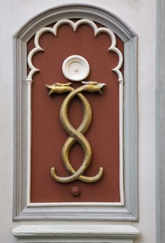 Wall decoration of two tangled snakes, Tallinn, Estonia