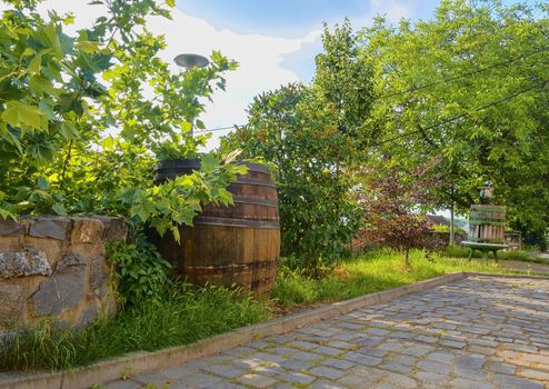 Old wine press and rustic wine barrel. Wine background in Europe. Czech Republic, South Moravia. 