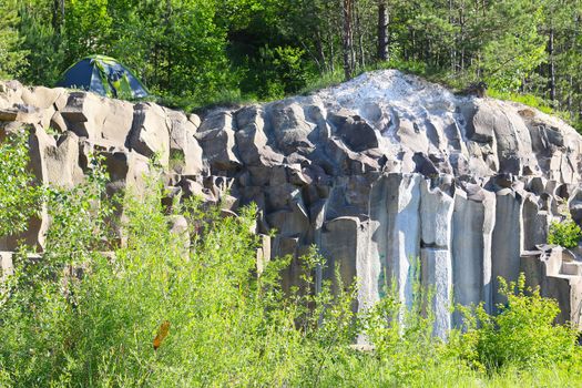 Tent weekend on basalt columns. Beautiful geological landscape