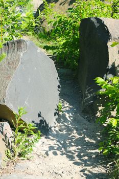 Two large basalt stones on trail. Beautiful geological landscape