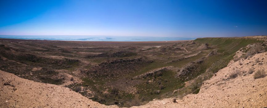Panorama view to Aral sea from the rim of Plateau Ustyurt near Duana cape in Karakalpakstan, Uzbekistan