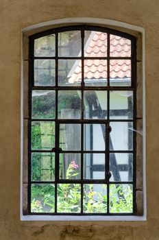 Historic old cast-windows in an old abandoned factory