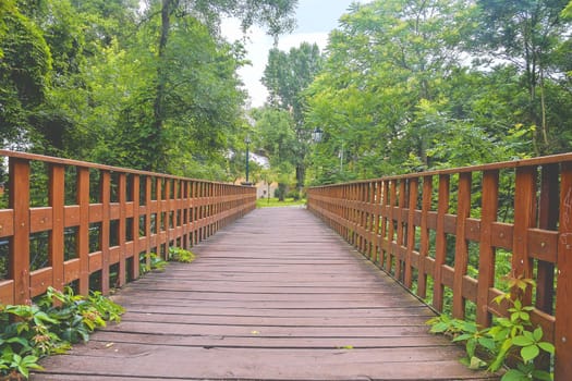 Wooden bridge in town, natural vintage background.