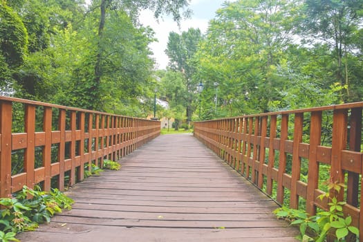 Wooden bridge in town, natural vintage background.