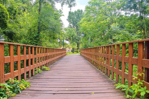 Old wooden bridge in town, natural vintage background.