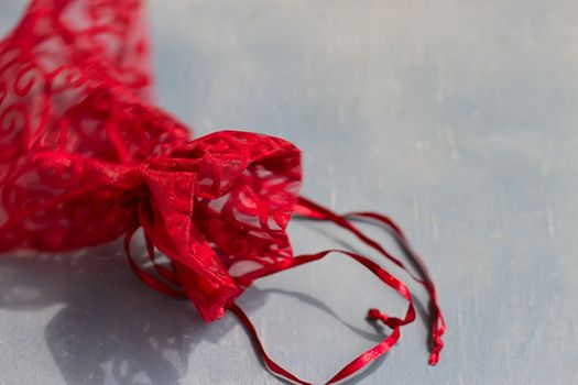 Red drawstring bag On a gray-blue background