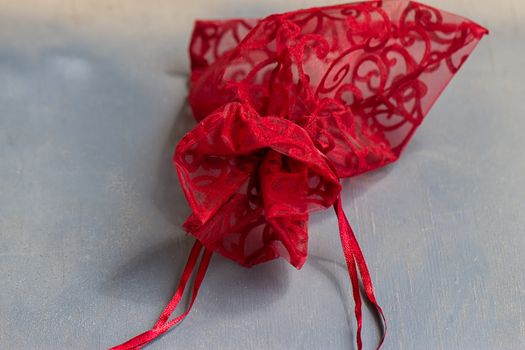 Red drawstring bag On a gray-blue background