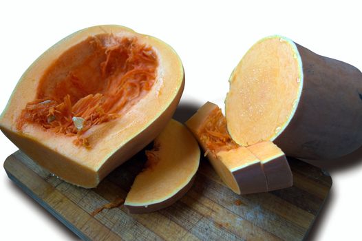 sliced pumpkin with wooden Boards on a white background