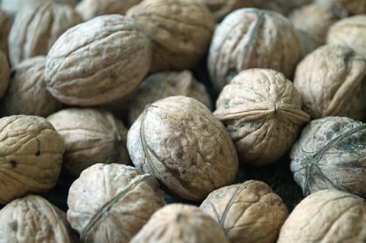 background with a handful of walnuts