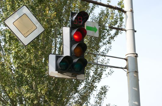 hanging on a pole lights with road signs