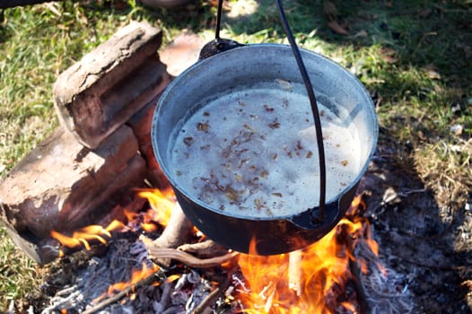 cauldron cooking food on an open fire
