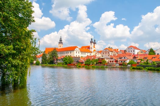 Panoramic view of Telc with reflection in Stepnicky pond, Czech Republic. UNESCO World Heritage Site.