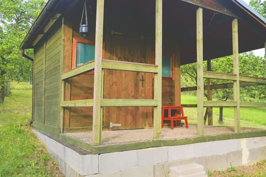 Small house cabin shed. Cute summer cabin in rural orchard