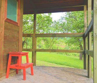 Wooden garden shed in a beautiful rural orchard. Close-up.