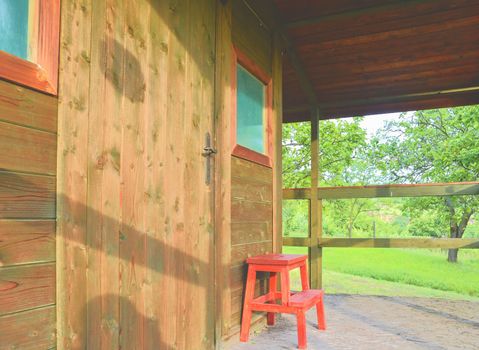 Wooden garden shed in a beautiful rural orchard. Close-up.