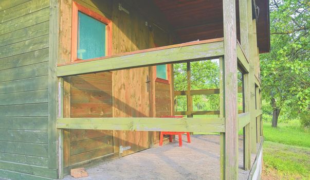 Wooden garden shed in a beautiful rural orchard. Close-up.