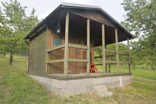 Small house cabin shed. Cute summer cabin in rural orchard