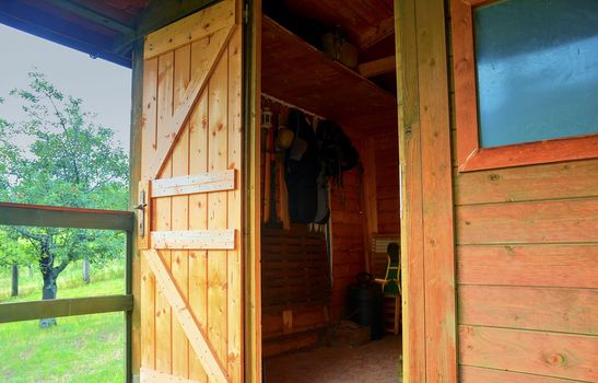 Small house cabin shed. Cute summer cabin in rural orchard.  Close-up.