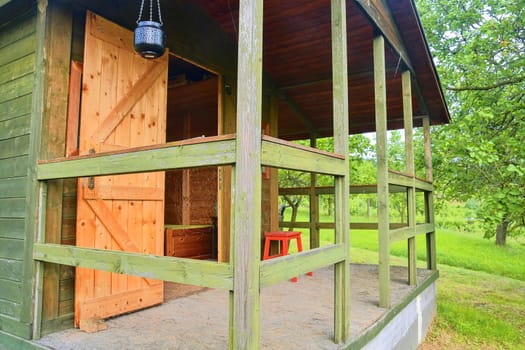 Small house cabin shed. Cute summer cabin in rural orchard.  Close-up.