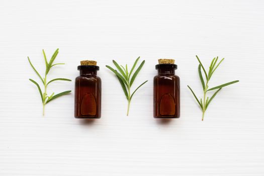 Rosemary essential oil on white