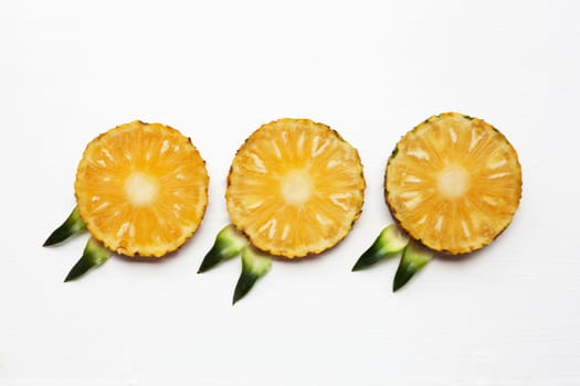 Slices of pineapple isolated on white background.