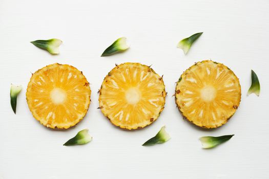 Slices of pineapple isolated on white background.