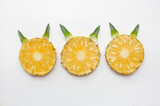 Slices of pineapple isolated on white background.