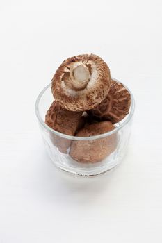 Shiitake mushrooms isolated on white background.