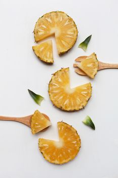 Slices of pineapple with leaf isolated on white background