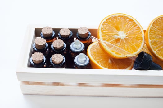 Orange essential oil isolated on white background.