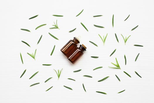 Rosemary essential oil on white