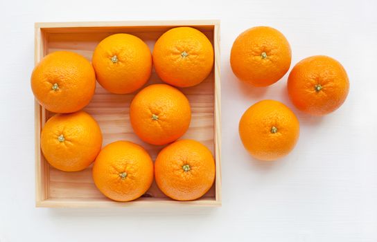 Fresh orange citrus fruit on white background. Top view