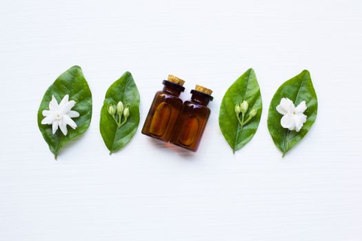 Essential oil with jasmine  flower on white background.